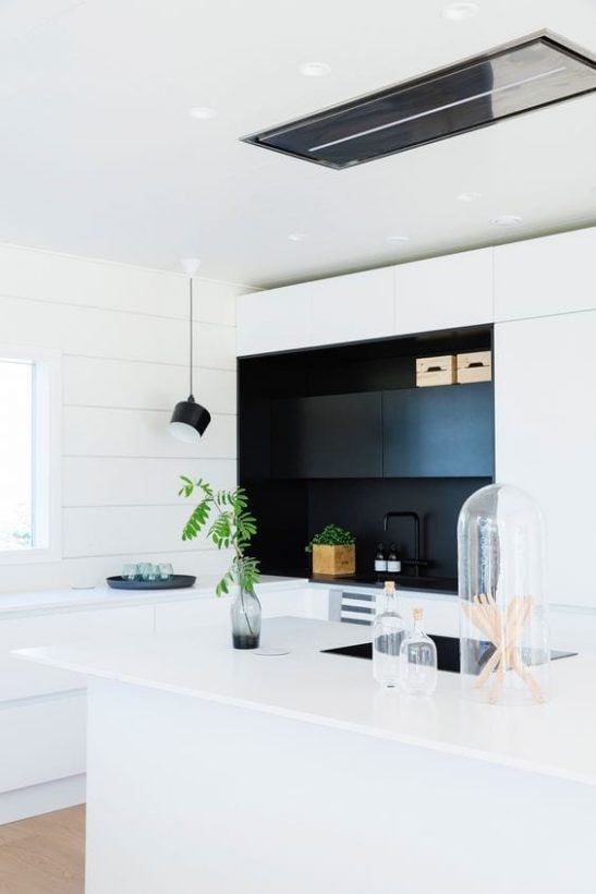 Black and white kitchen in a modern log home