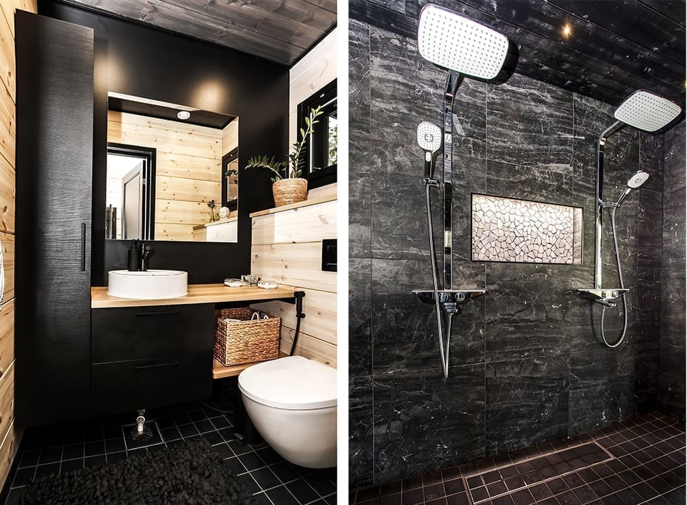 Ett svart timmerhus i lantlig miljö